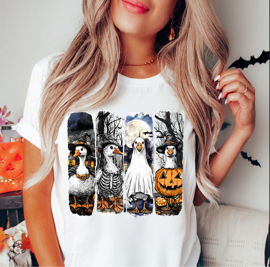 Halloween Goose Squad graphic tee with geese dressed as skeleton, ghost, and pumpkin on white shirt
