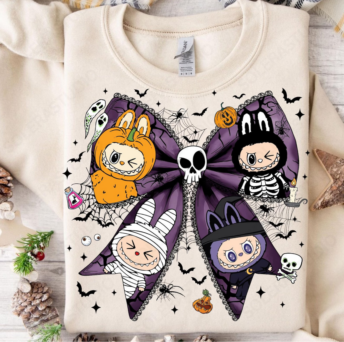 “Labubu Halloween sweatshirt with purple bow and pumpkin, skeleton, mummy, and witch characters”

“Close-up of Labubu spooky bow graphic with skull, bats, ghosts, and spiderwebs”

“Cream Labubu Halloween sweatshirt flat lay with fall decorations”

“Cozy unisex Labubu Halloween sweatshirt for spooky season”
