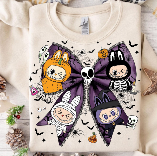 “Labubu Halloween sweatshirt with purple bow and pumpkin, skeleton, mummy, and witch characters”

“Close-up of Labubu spooky bow graphic with skull, bats, ghosts, and spiderwebs”

“Cream Labubu Halloween sweatshirt flat lay with fall decorations”

“Cozy unisex Labubu Halloween sweatshirt for spooky season”