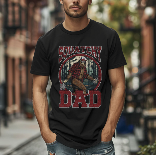Squatchy Dad graphic tee with retro Bigfoot in flannel shirt on black shirt
