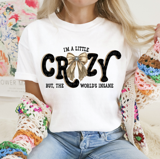 I'm a Little Crazy but the World's Insane graphic tee with bow design on white shirt
