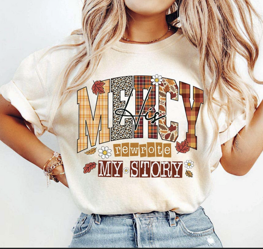 Mercy Rewrote My Story T-Shirt – fall Christian graphic tee with plaid and leopard print lettering