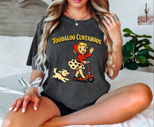 “Vintage style graphic tee with retro girl riding a scooter with a dog and humorous phrase Toodaloo Cuntaroos.”