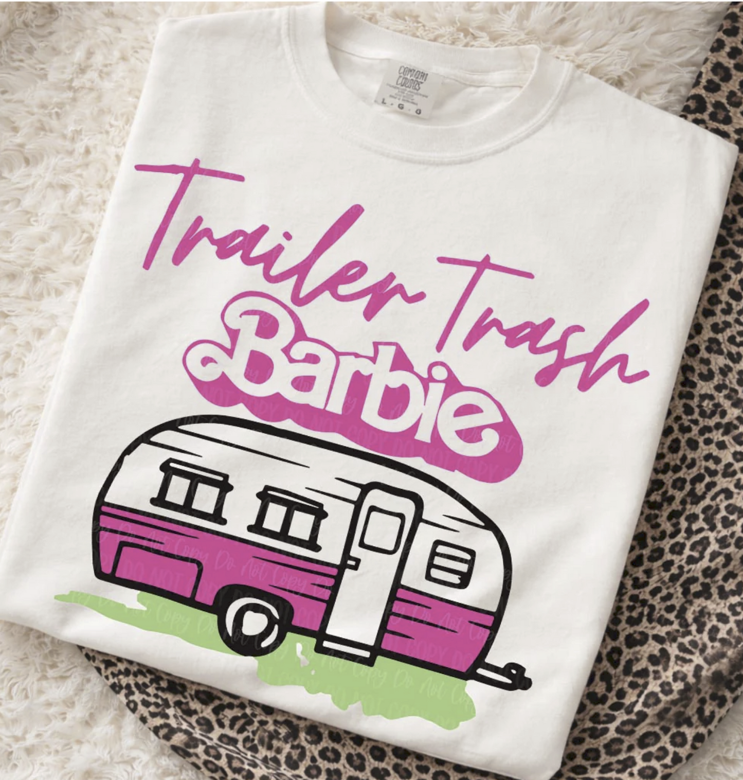 White shirt with pink camper graphic and “Trailer Trash Babe” text