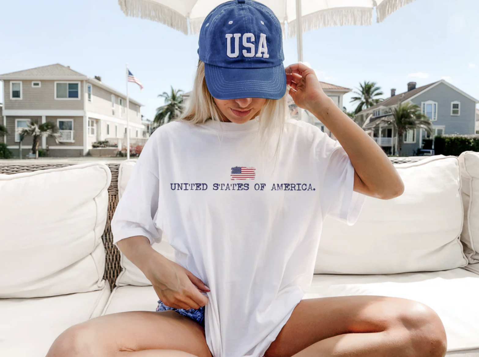 White patriotic t-shirt featuring a small American flag and United States of America graphic design.