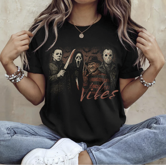 "Creepy Vibes horror villains t-shirt with Michael Myers Ghostface Freddy Jason"

"Dark spooky season graphic tee slasher icons"

"Unisex creepy vibes scary movie horror t-shirt"