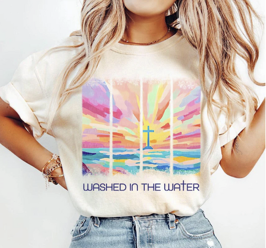 "Christian graphic tee with pastel sunset and cross design – Washed in the Water"

"Faith-based unisex t-shirt in beige, white, or black"