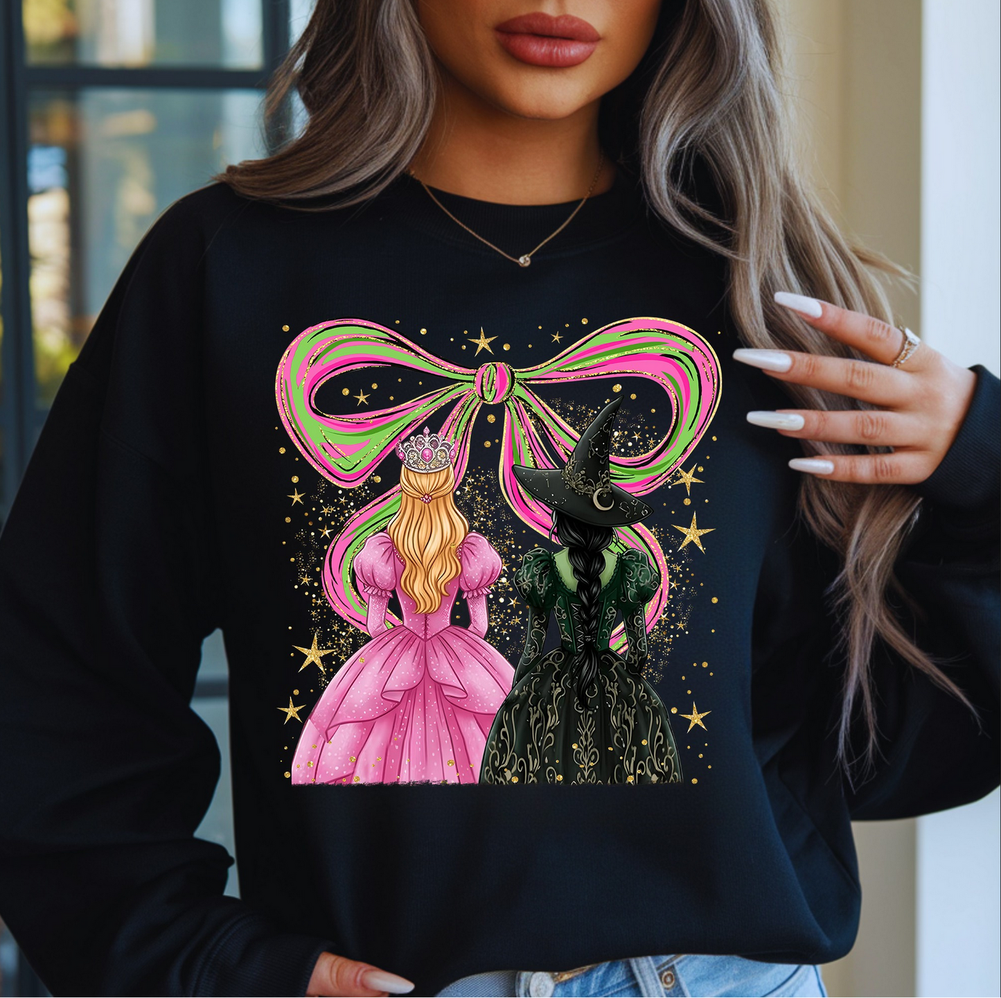 Woman wearing black sweatshirt with two fantasy witches and glitter bow design

Pink and green witchy besties graphic on cozy sweatshirt

Magical fantasy crewneck with celestial stars

Black pullover with whimsical witchy artwork