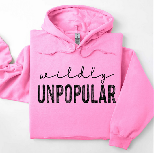 Pink t-shirt with bold black lettering “Wildly Unpopular” – funny sarcastic graphic tee