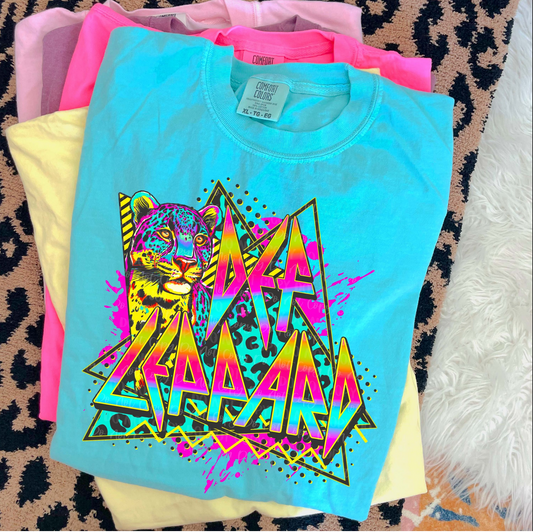Def Leppard neon leopard graphic tee in blue with retro rock band design
