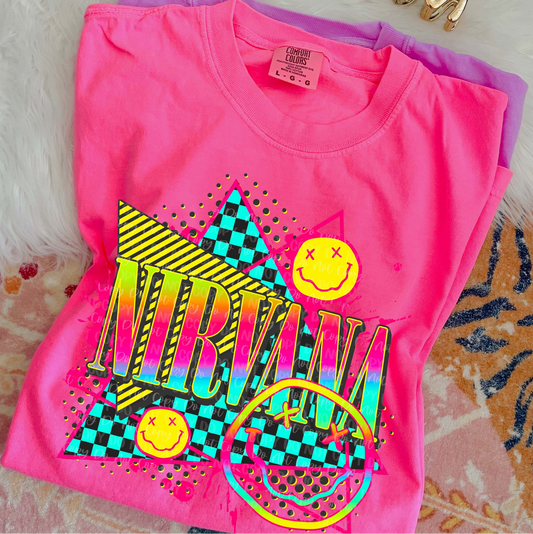 Nirvana neon retro graphic tee in pink with checkered background and smiley face design
